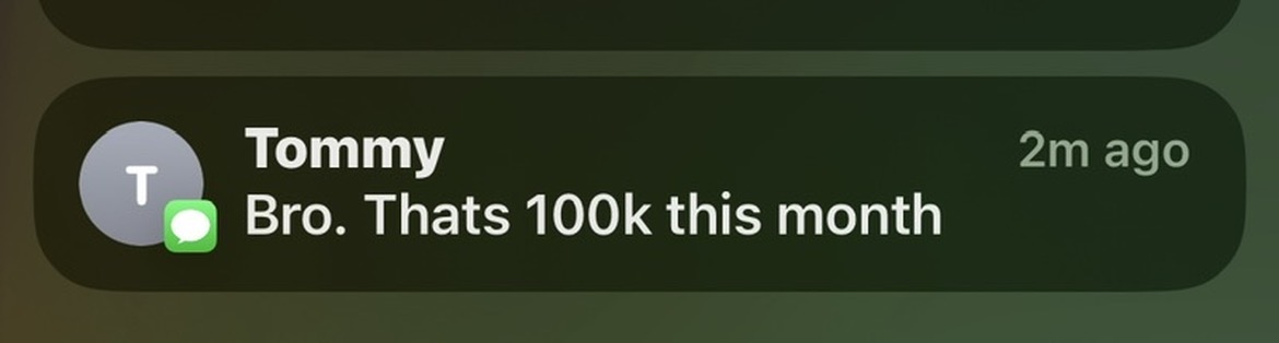 Push notification text from Tommy reading: Bro. Thats 100k this month